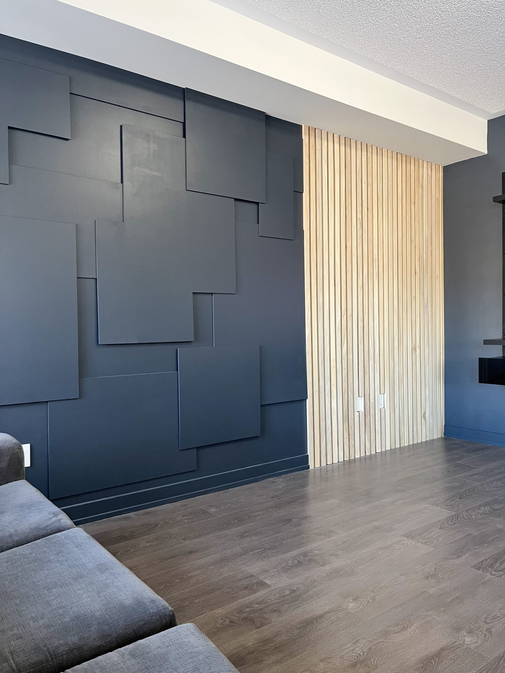 Modern black accent wall living room reveal - Hana